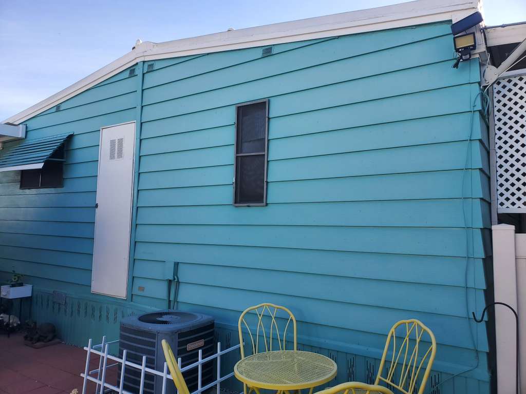 Modern home exterior repainted in coastal blue across Southern California — serving Riverside, Riverside County
