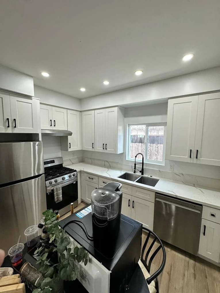 Updated kitchen with repainted walls and cabinetry by CM Painters